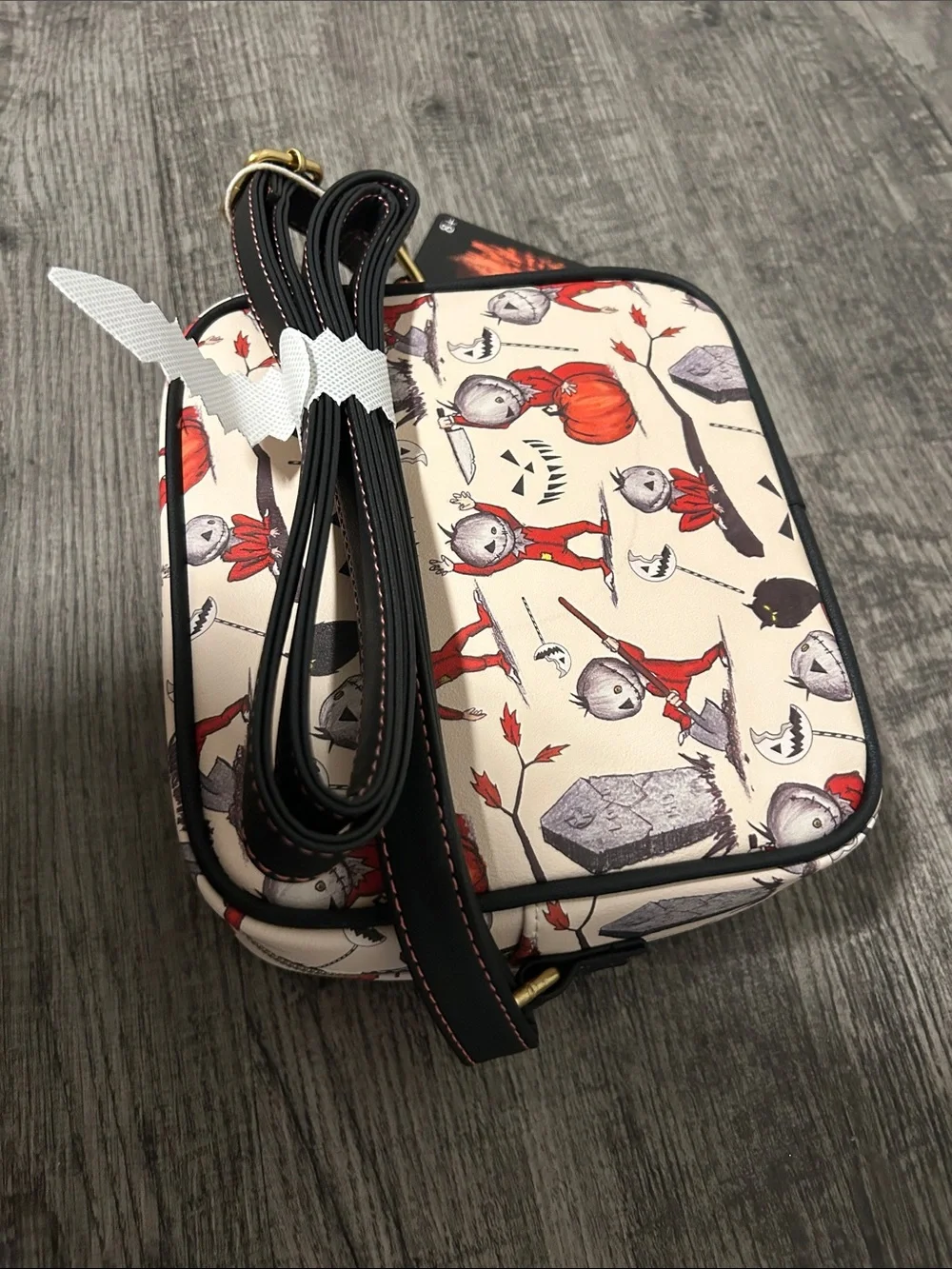Loungefly Cream Crossbody Bag with Red Halloween Character Print